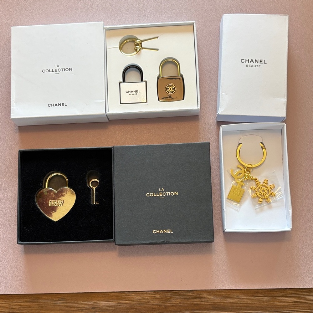 CHANEL Gold and Black Padlock Keychain Collection